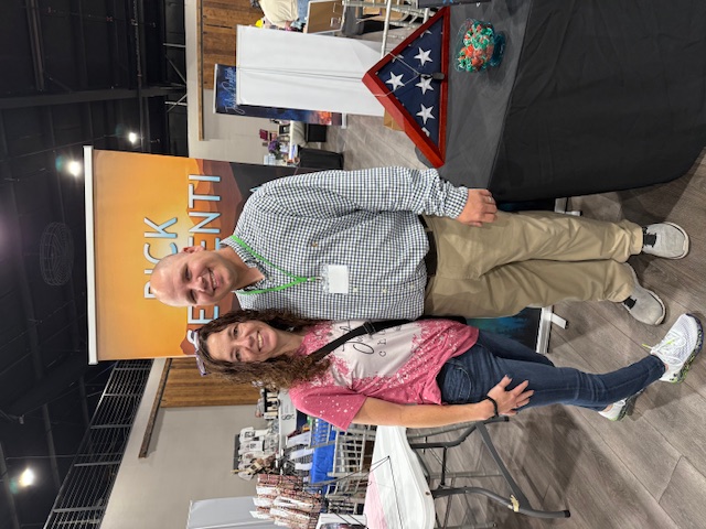 Rick Serrenti posing with a reader at the Books Books Books Event