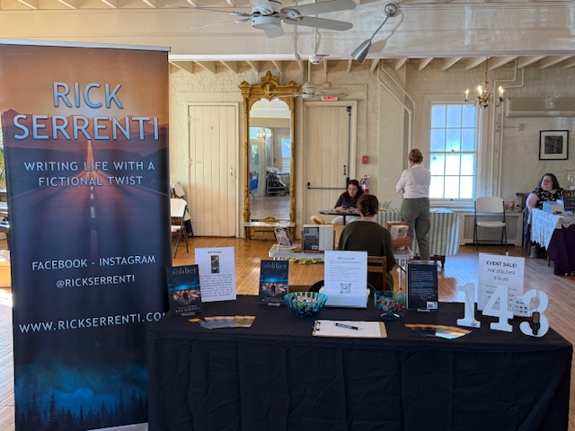 Rick Serrenti banner on display at Books in Bloom