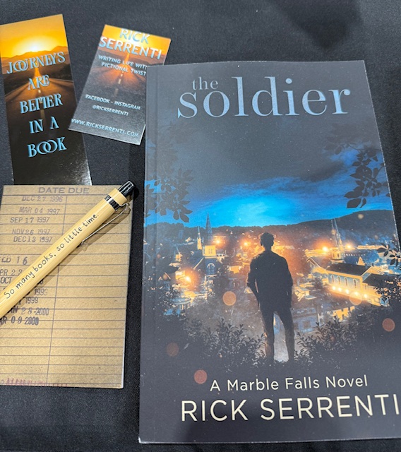 The Soldier by Rick Serrenti with bookmarks and a vintage library date card